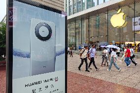 Huawei Mobile Advertising Appears in Front of The Apple Store in Shanghai