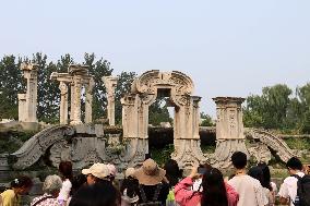 Visitors Visit The Old Summer Palace Ruins Park in Beijing, China