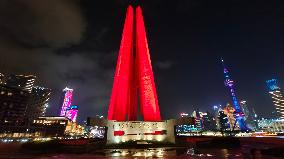 Tourists Visit The Red Landmark Monument to The People's Heroes in Shanghai, China