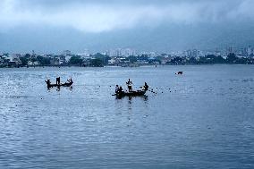 Fishermen Catch Fish Inside The Lake In Ajmer - India