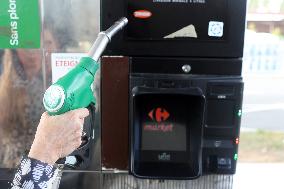 A Motorist Fills Her Car At A Petrol Station In Premery