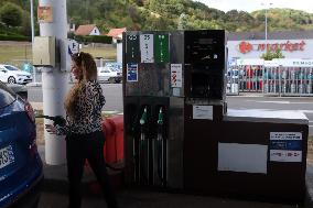 A Motorist Fills Her Car At A Petrol Station In Premery