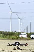 Drone used for inspection of wind-power generation facility
