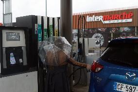 A Motorist Fills Her Car At A Petrol Station At Intermarché Hypermarket In Charité Sur Loire