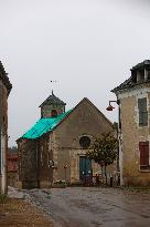 Picture Of A Church At Saint Aubin-les-Forges Center In France. Emmanuel Macron Launches A “national Collection” To Save Ruined