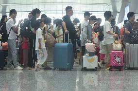 Passengers Wait For The Train at Hangzhou East Railway Station