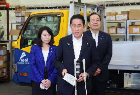 Japan PM Kishida visits logistics company