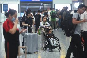 Passengers Wait For The Train at Hangzhou East Railway Station