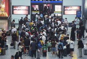 Passengers Wait For The Train at Hangzhou East Railway Station