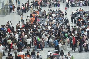 Passengers Wait For The Train at Hangzhou East Railway Station