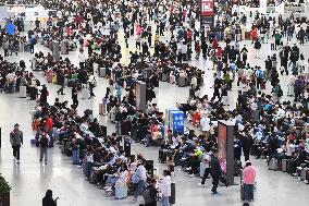 Tourists Line Up at Changchun Railway Station in Changchun