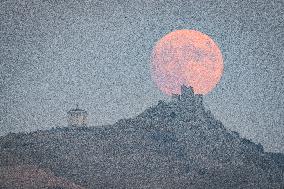Harvest Full Moon Rises In Calascio, Italy