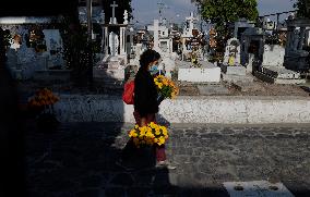 Families Visit The San Andres Mixquic Cemetery, Mexico, On The Occasion Of Saint Michael The Archangel's Day