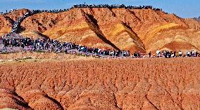 Tourists Visit Danxia Scenic Spot in Zhangye