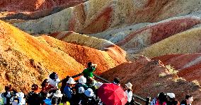 Tourists Visit Danxia Scenic Spot in Zhangye