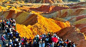 Tourists Visit Danxia Scenic Spot in Zhangye