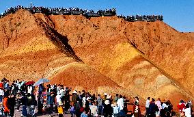 Tourists Visit Danxia Scenic Spot in Zhangye