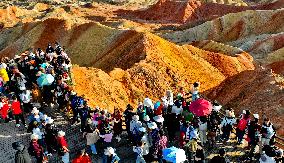 Tourists Visit Danxia Scenic Spot in Zhangye