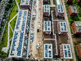 Solar Panels On The Roofs Of New Homes Under Construction - Utrecht