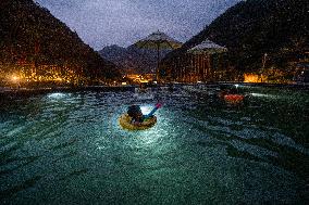 Tourists Soak in Hot Springs in Bijie