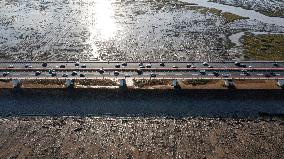 Vehicles Drive on The Hangzhou Bay Cross-Sea Bridge in Ningbo