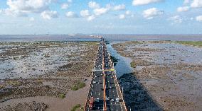 Vehicles Drive on The Hangzhou Bay Cross-Sea Bridge in Ningbo