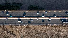 Vehicles Drive on The Hangzhou Bay Cross-Sea Bridge in Ningbo