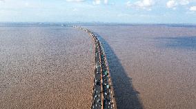 Vehicles Drive on The Hangzhou Bay Cross-Sea Bridge in Ningbo