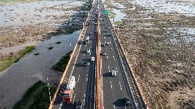 Vehicles Drive on The Hangzhou Bay Cross-Sea Bridge in Ningbo