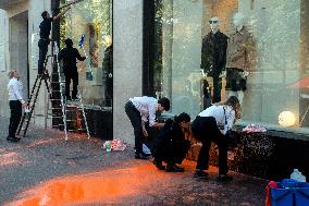 Activists Spray Louis Vuitton Window With Orange Paint - Paris