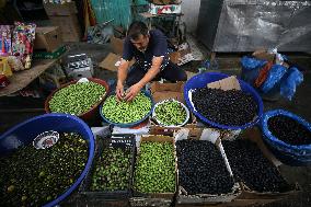 Palestinian Vendor Sells Olives