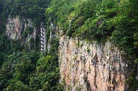 Tourists Experience The Thrilling Rock Climbing on a Cliff in Ningbo