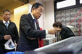 Japan PM visits small rubber product maker in Tokyo