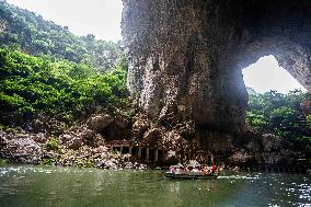 Tourist Visit Karst Cave Scene in Bijie