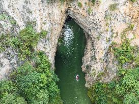 Tourist Visit Karst Cave Scene in Bijie