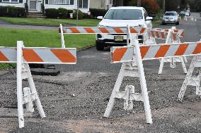 Sinkhole Affects Roads After Heavy Rainfall And Flooding