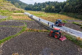 Farmers Plow Land in Congjiang