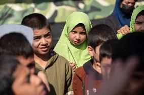 Iran-Afghan Refugee Child Laborer And International Children's Day