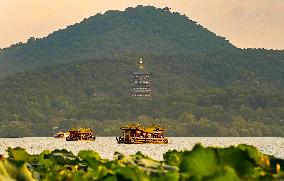 Visitors Enjoy The Sunset Scenery of the West Lake in Hangzhou