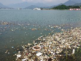 A Worker Salvages Floating Objects in the Yangtze River