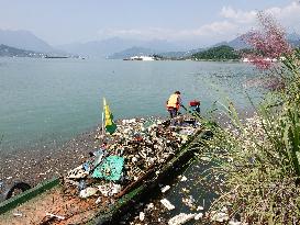 A Worker Salvages Floating Objects in the Yangtze River