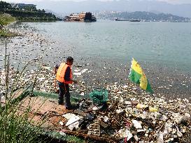 A Worker Salvages Floating Objects in the Yangtze River