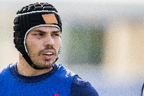 Antoine Dupont using a head guard during a training session - Paris