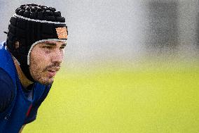 Antoine Dupont using a head guard during a training session - Paris