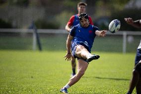 Antoine Dupont using a head guard during a training session - Paris