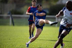 Antoine Dupont using a head guard during a training session - Paris