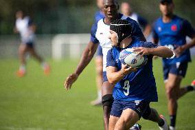 Antoine Dupont using a head guard during a training session - Paris