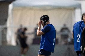 Antoine Dupont using a head guard during a training session - Paris