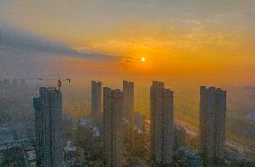 Buildings Under Construction Under The Rising Sun