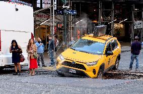 Taxi Stuck In Hole - NYC